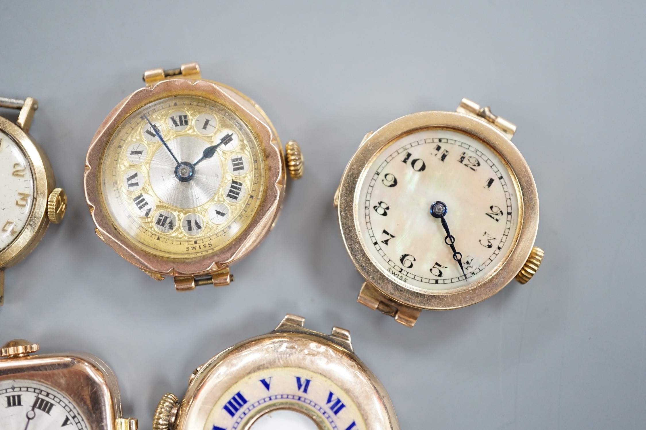 Four assorted lady's mainly early to mid 20th century 9ct gold manual wind wrist watches, including Vertex & Zenith and one other yellow metal wrist watch, all lacking straps.